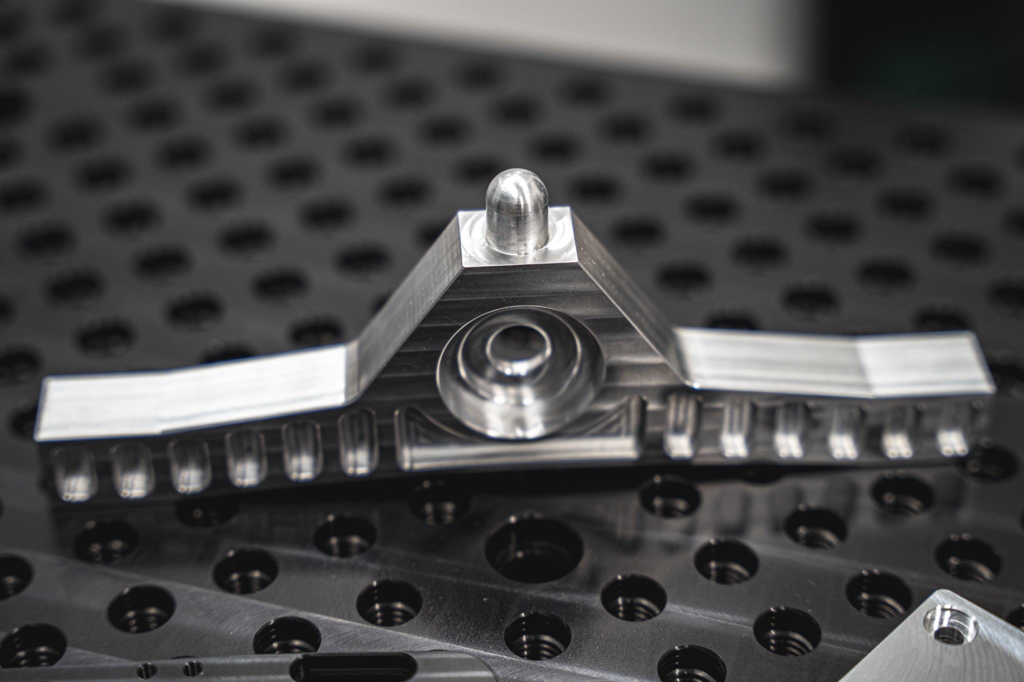 Close-up of a machined metal component with detailed features